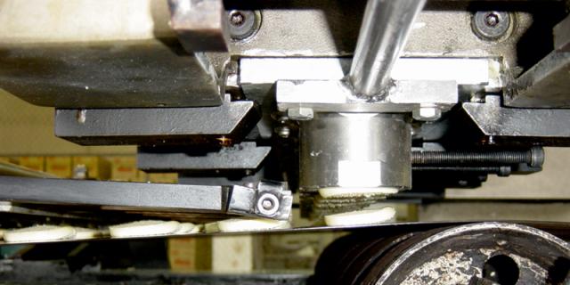 FIG 7 Dough pieces being cut and deposited on the oven band