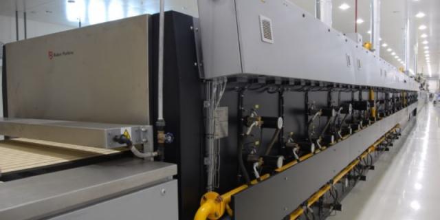 Baker Perkins direct gas fired cracker oven with pre-heat burners below the return band