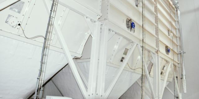 An installation of indoor metal silos in a modern bakery plant